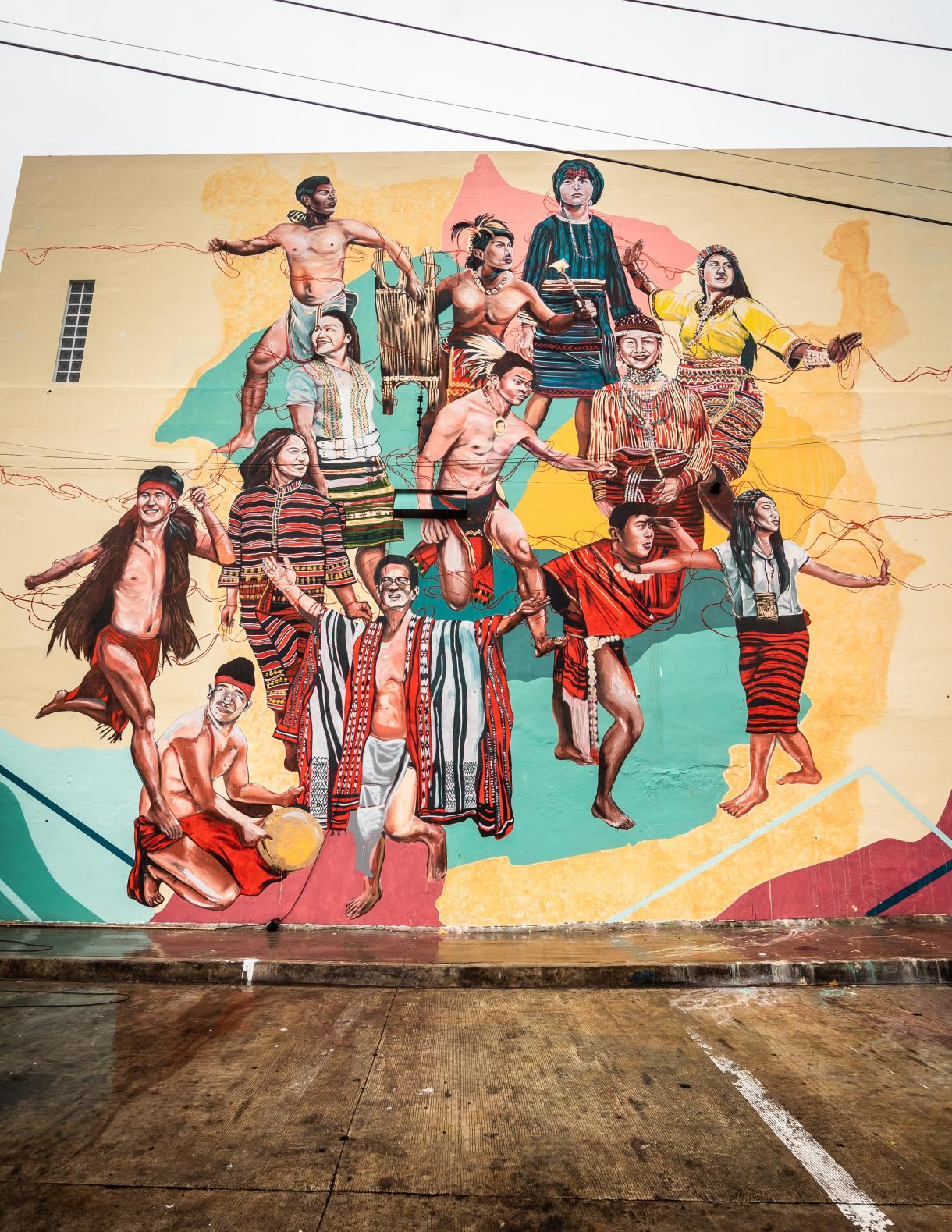 street mural with various individuals in different actions